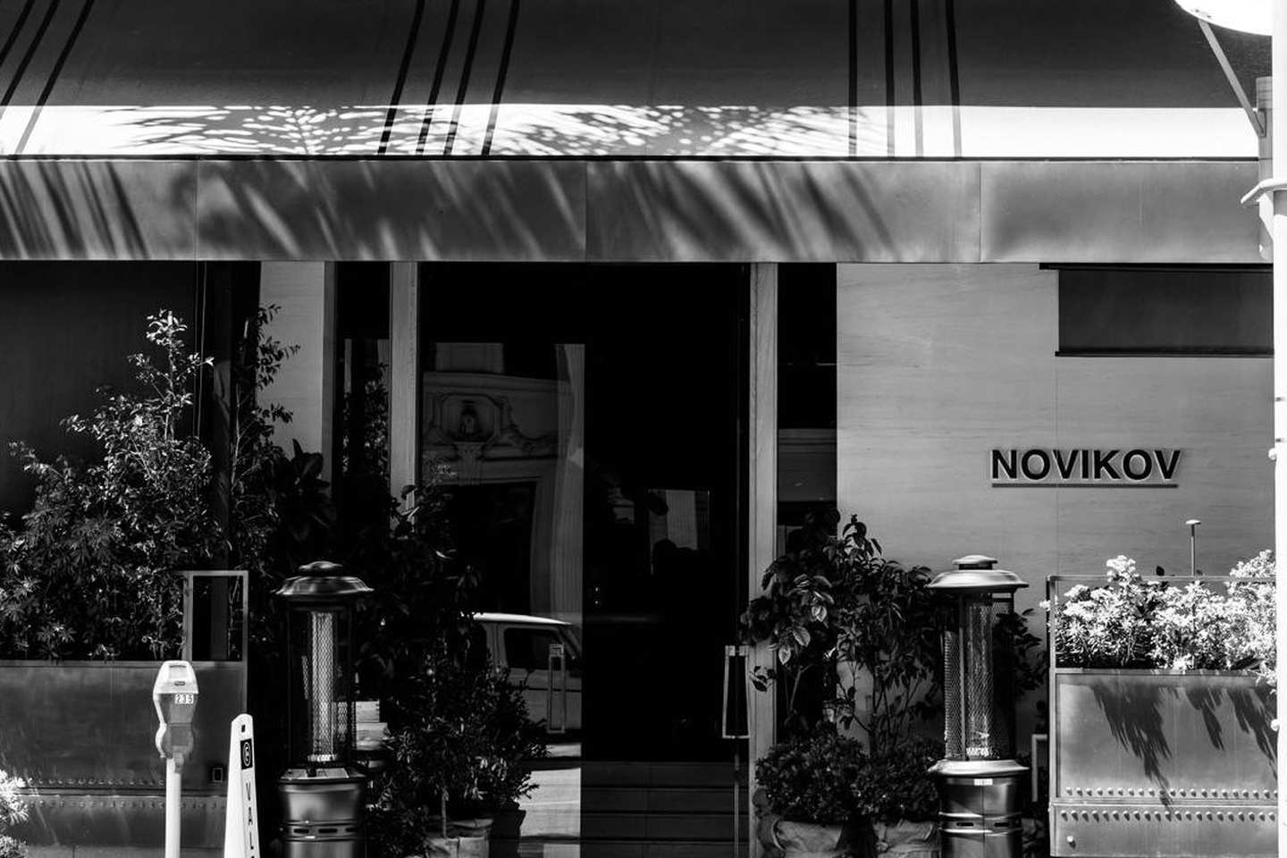 Novikov Beverly Hills restaurant entrance with signage and outdoor seating